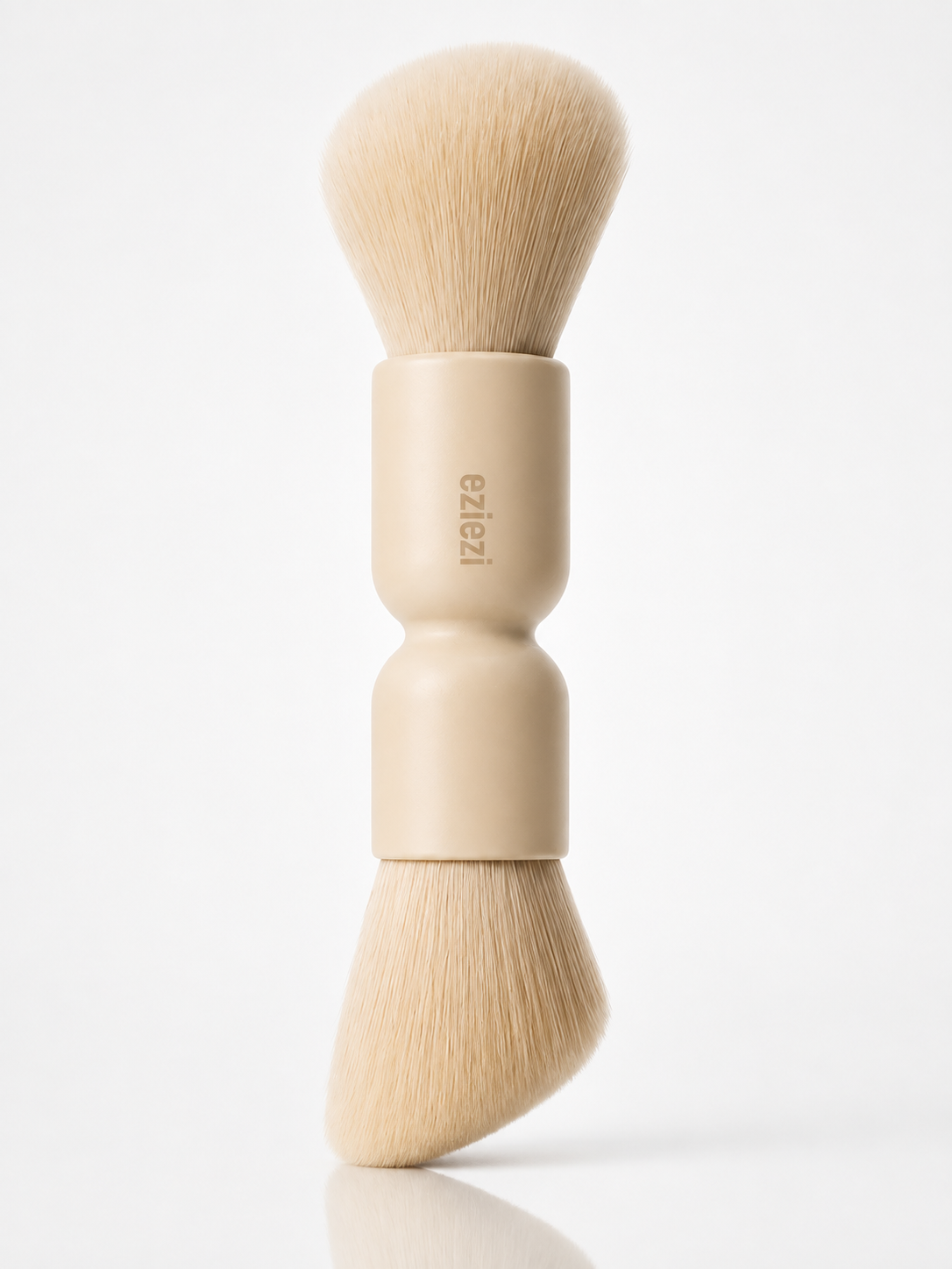 Saint Future Pocket Dual Brush on white, with a round powder head and an angled sculpt head