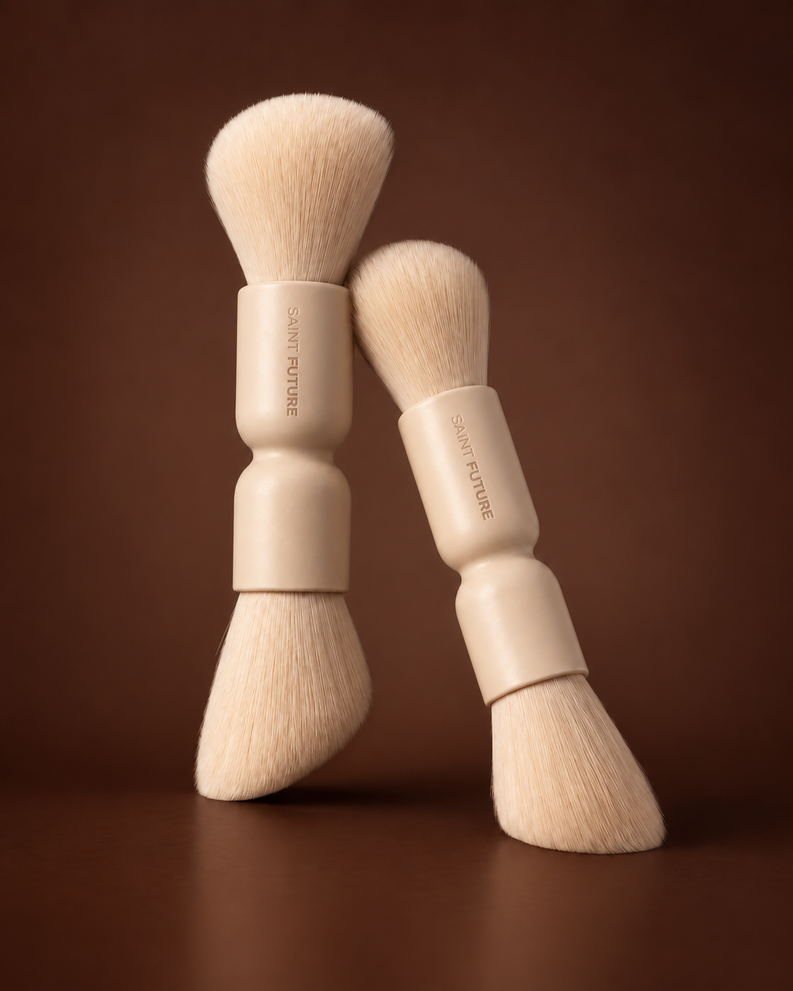 Saint Future Pocket Dual Brush on white, with a round powder head and an angled sculpt head
